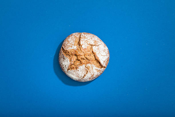 High Angle View Of Bread Against Blue Background stock photo