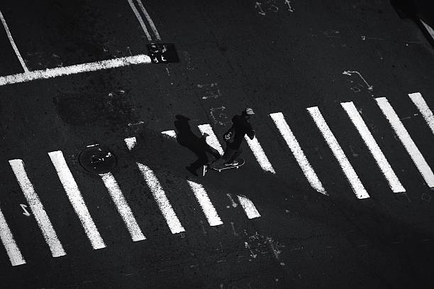 istock High Angle View Of Man Skateboarding On Road 600765307