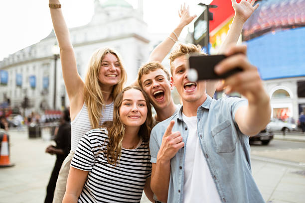 istock friends take a selfie in piccadilly circus 600991020