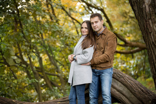 istock Romantic couple in autumn park, 600991740