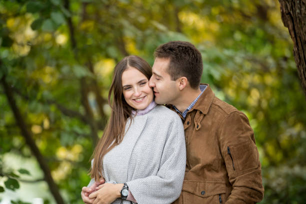 istock Romantic couple in autumn park, 600991820