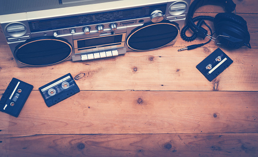 Eighties music hero header with old cassette player and tapes with headset.