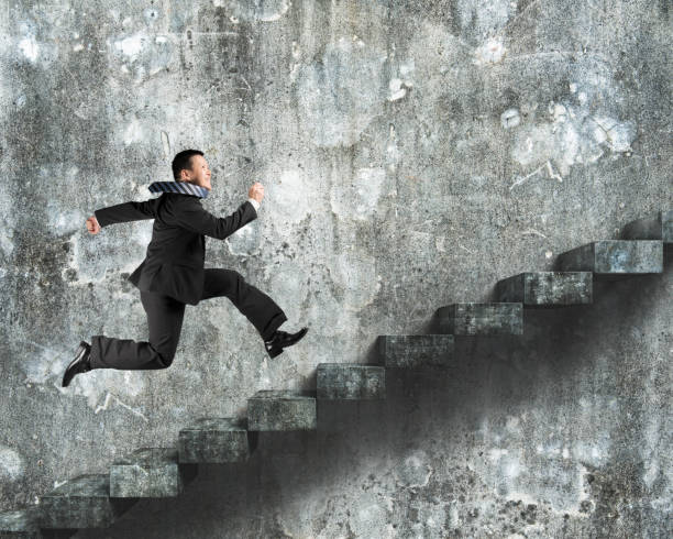 istock Man running on old dirty concrete stairs 600992404