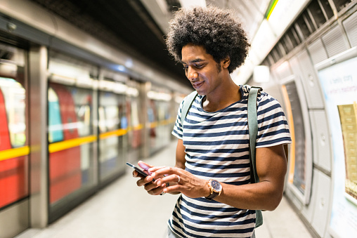 solo traveler on a london station