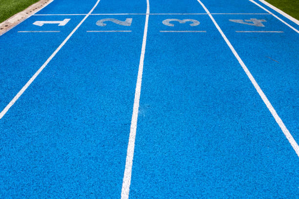 istock background of blue track for running competition at stadium 600994108