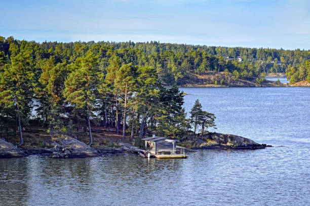 istock Wooden sauna log cabin on island 600994788