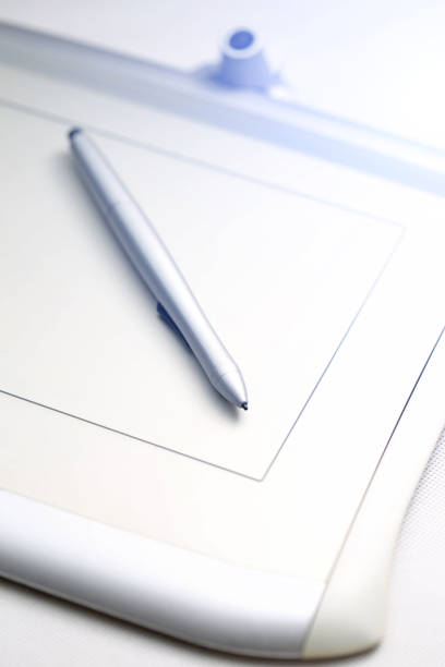 istock graphic tablet and pressure sensitive pen on white background 600995434