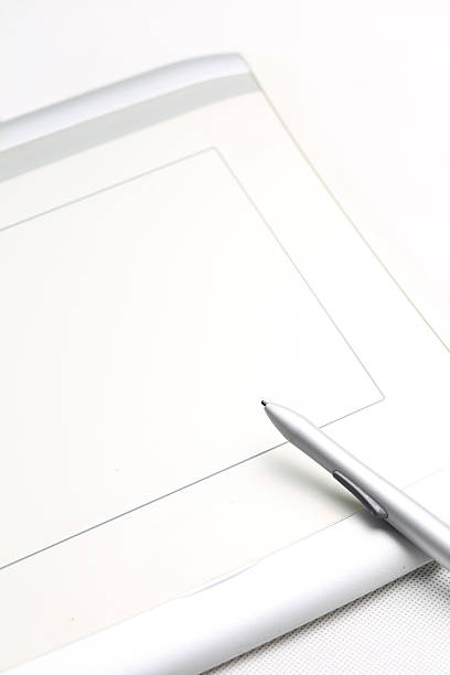 istock graphic tablet and pressure sensitive pen on white background 600996184