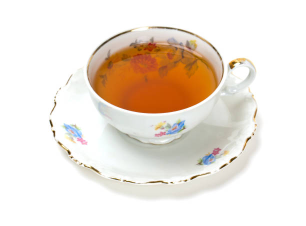 istock tea in vintage cup isolated on white 600996626