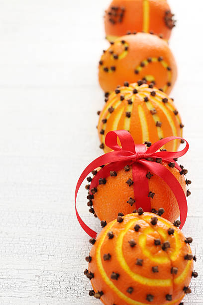 clove orange pomander balls clove orange pomander balls, homemade christmas gift scent container stock pictures, royalty-free photos & images