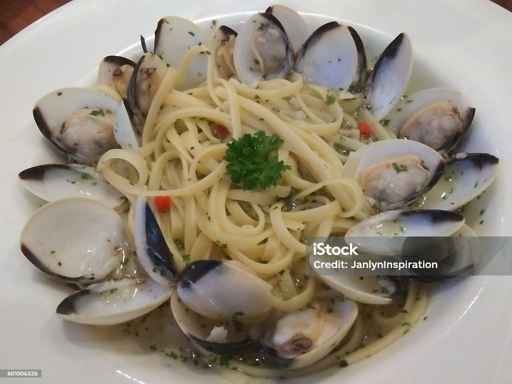 Spaghetti With Clams - Linguine version Spaghetti Alle Vongole cooked in white wine - Linguine version Clam - Seafood Stock Photo