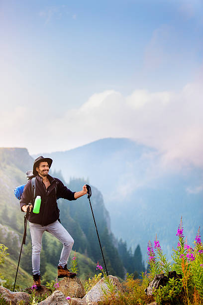 istock Hiker reaching the mountain top 601006460