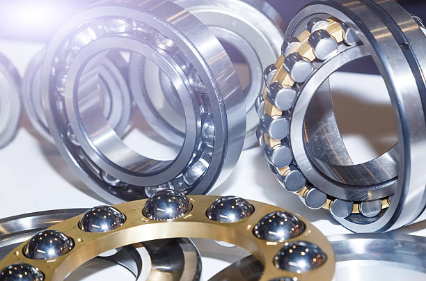 series of ball bearings background with light effect close-up - ball bearing engineer machine part gear imagens e fotografias de stock