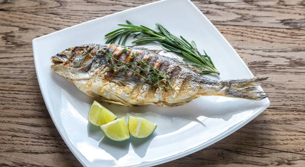 istock Grilled Dorade Royale Fish on the plate 601007420
