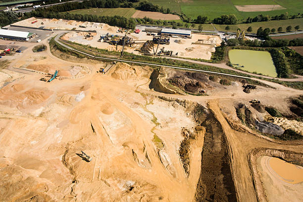 istock Gravel and sand quarry - aerial view 601008524