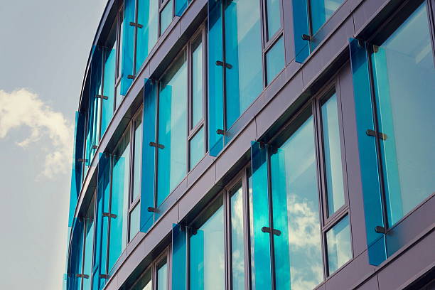 Blue brise soleil sun breakers on modern office glass building stock photo