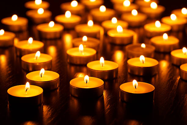 istock Many burning candles with shallow depth of field 601009364