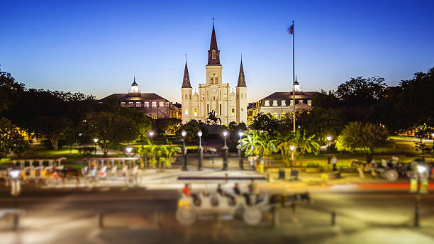 Jackson Square in New Orleans, Louisiana French Quarter at Night St Louis Cathedral and Jackson Square in New Orleans French Quarter as night falls in Louisiana (People blurred for commercial use) jackson square stock pictures, royalty-free photos & images