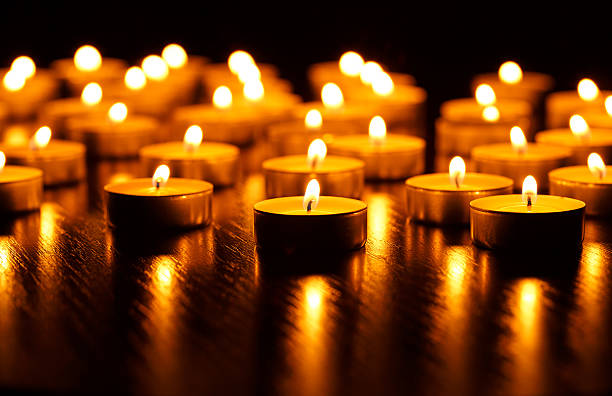 istock Many burning candles with shallow depth of field 601009620