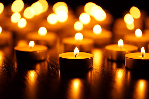 istock Many burning candles with shallow depth of field 601009760