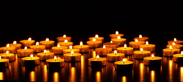 istock Many burning candles with shallow depth of field 601009814