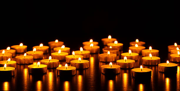 istock Many burning candles with shallow depth of field 601009858