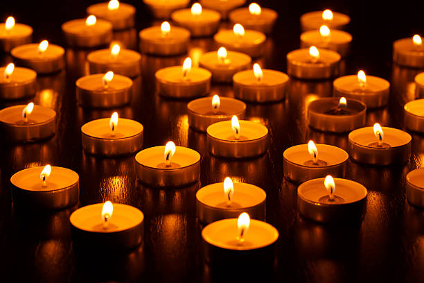 istock Many burning candles with shallow depth of field 601010224