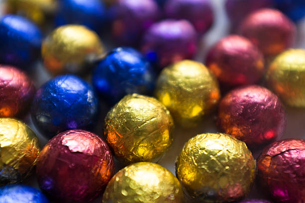 istock chocolate balls in foil. 601010446