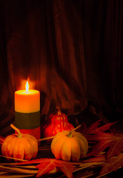 istock Autumn candle, pumpkins, gourd glow in candlelight (P) 601016810