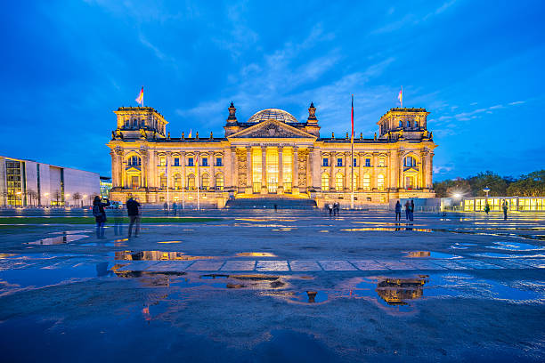 istock The Reichstag building at night in Berlin, Germany 601017448