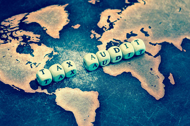 istock TAX AUDIT on grunge world map 601019364