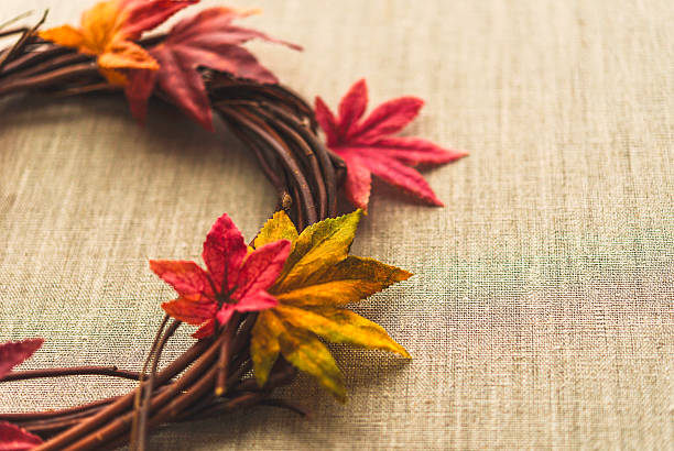 istock Fall leaves background with wreath on burlap for Thanksgiving 601019408