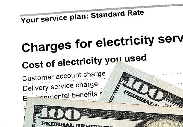 istock Residential Electricity Bill with US Currency 601023502