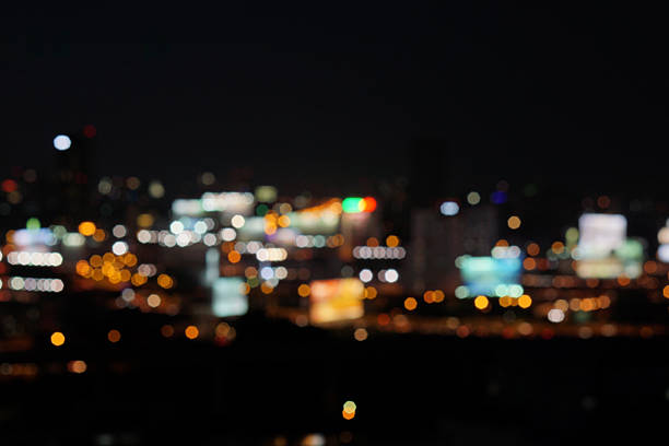istock blur photo with bokeh light of high building 601023512