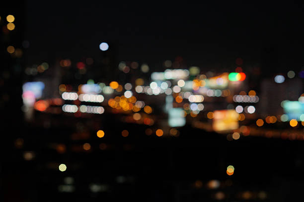 istock blur photo with bokeh light of high building 601023652