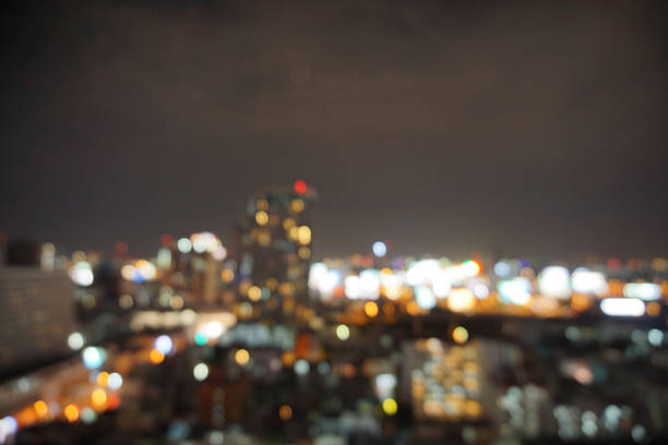 istock blur photo with bokeh light of high building 601025184