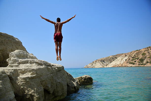istock Men jumping in the sea 601028520