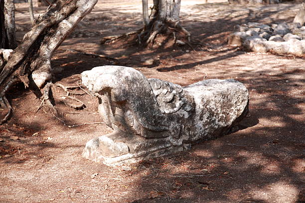 Feathered stone serpent of Osario pyramid, at Chichen Itza, Mexico. stock photo