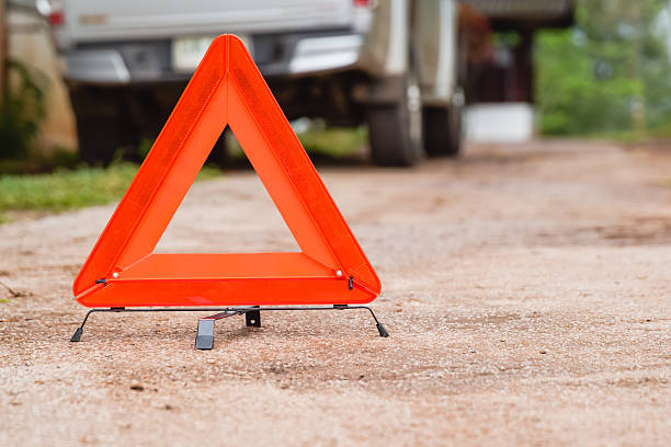 istock Triangle Red emergency stop sign, broken, damaged cars parked on 601030824