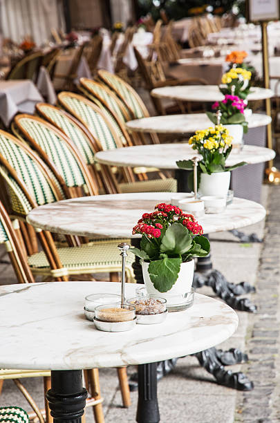 istock Wicker chairs and stone tables with potted flowers 601032898