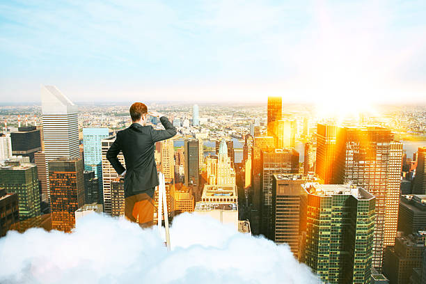 istock Businessman looking to city 601034104