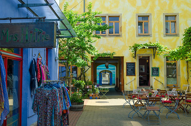 Dresden, Germany - April 23, 2014: Dresden, Germany, Saxony. Entrance at the Kunsthofpassage with colorful facades and shops. This area is a art project of some artists, painting the walls around the backyard. Its a tourist attraction outside the old town of Dresden.
