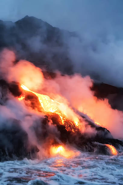 istock Molten lava flowing into the Pacific Ocean 601038220