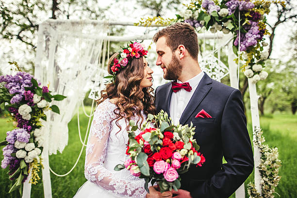 istock bride and groom outdoors 601107280