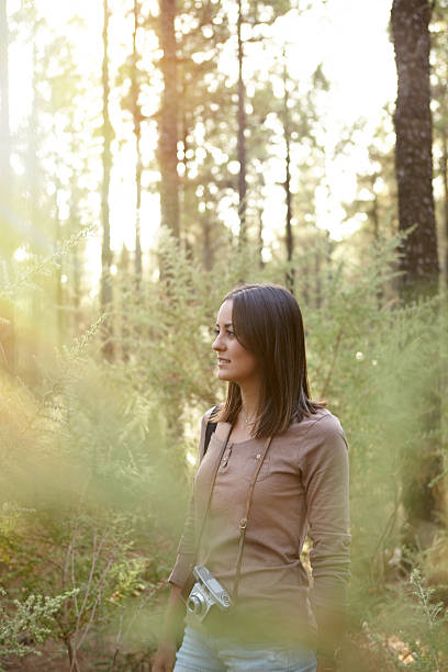 istock Cute smiling young girl in a forest 601117440