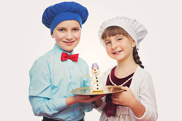 istock Children holding christmas dessert 601118640
