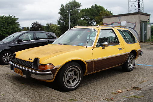 Almere, The Netherlands - September 11 2016: Yellow AMC Pacer Wagon on a public parking lot in the city of Almere. Nobody in the vehicle.