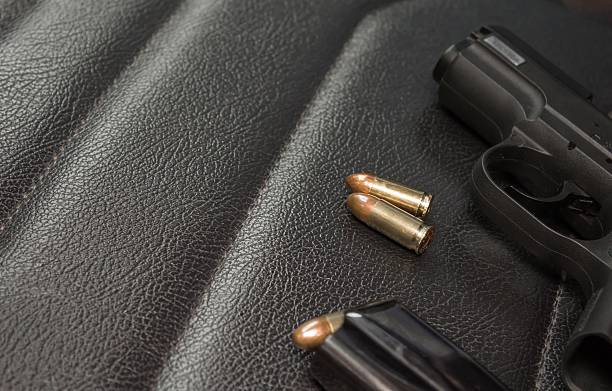 istock pistol with magazine and ammunition 601124294
