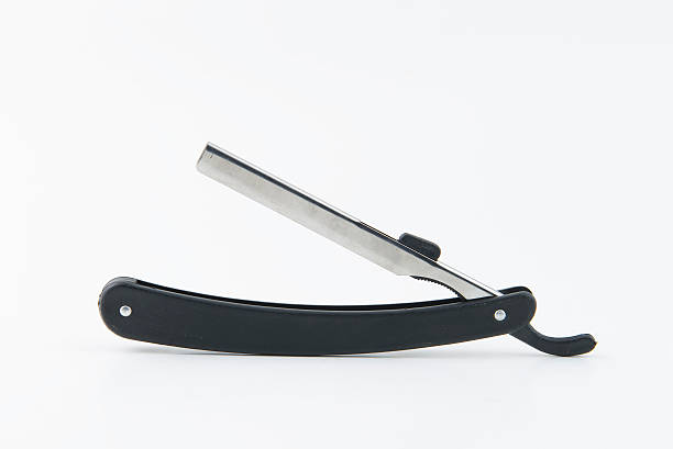 istock Old black cutthroat razor isolated over white 601125848