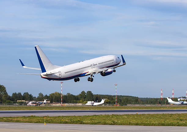istock white modern passenger plane took off from strip  rear view 601128116